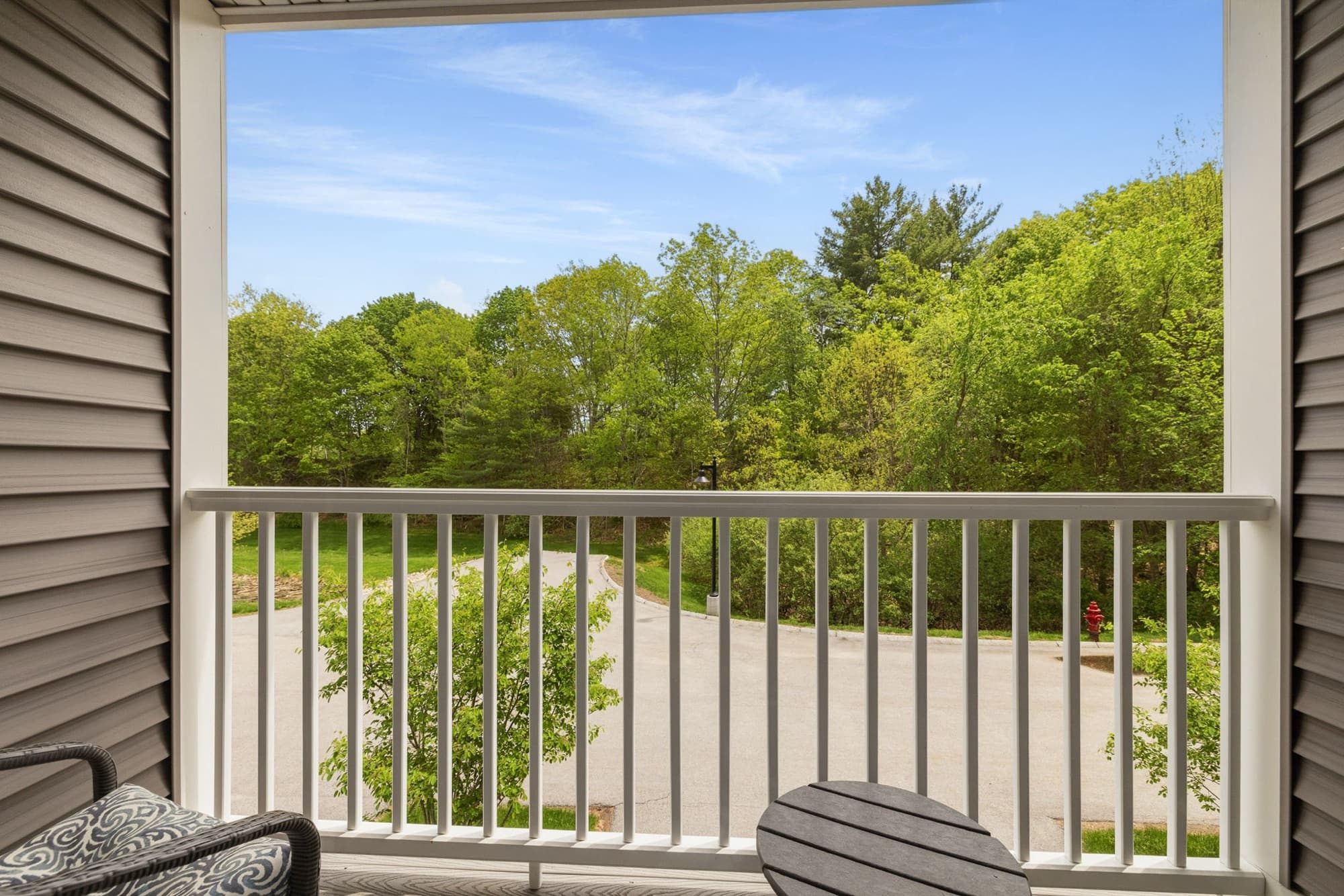 Balcony overlooking wooded conservation land